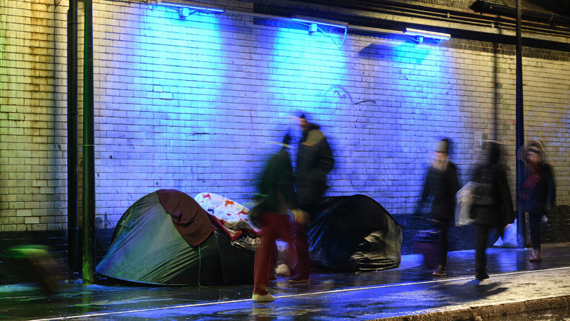 Homeless people underneath train tracks in London