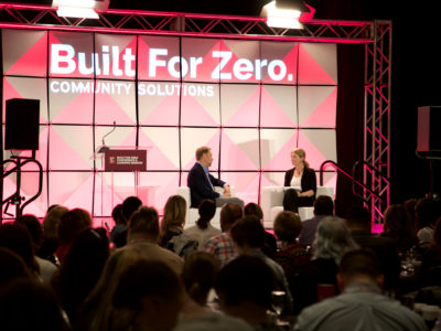 Built for Zero conference with panel members discussing on stage