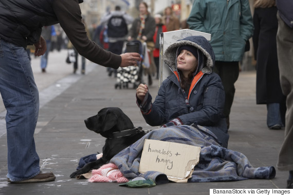 Homeless woman asking for donations