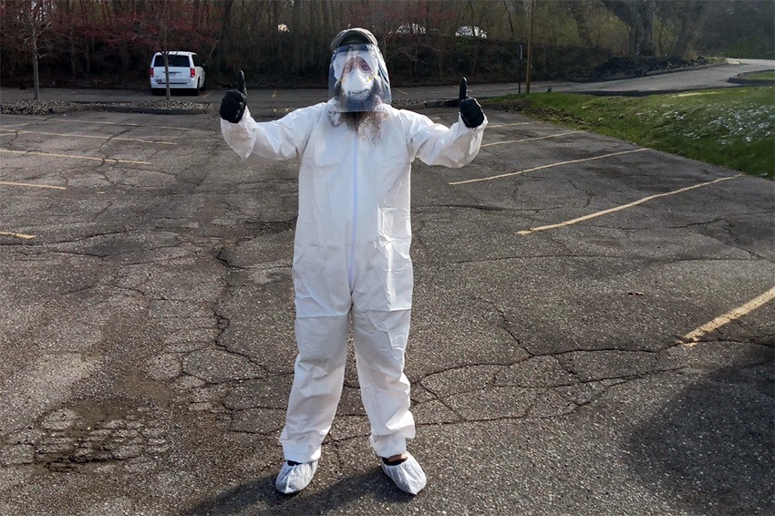  Avalon Housing Property Management Team Lead Joel Barson wearing personal protective equipment in order to enter a unit. Many of the Michigan-based housing provider's procedures have moved online during the pandemic. 