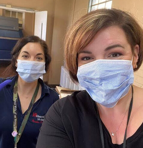 Erin Mangano, Homeless Program Clinical Manager, and Kerry Thomas, Coordinated Entry Specialist at the VA in Cook County. Both in face masks taking a selfie