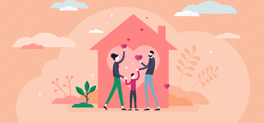 A family holds hearts up inside of a house. Credit: Charity Navigator