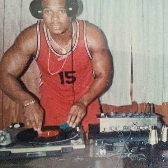 Younger "DJ Brooklyn Rico" at turntable