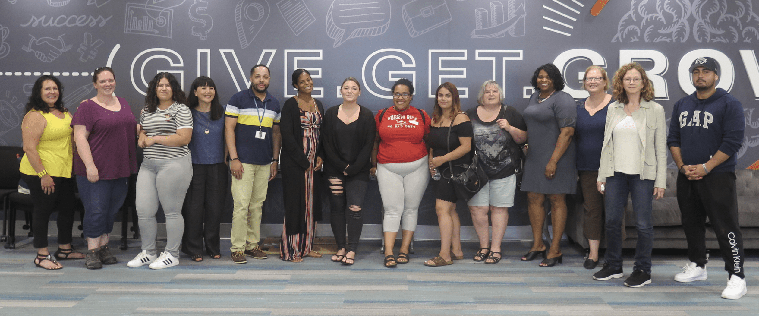 Group of workshop participants standing in a row.