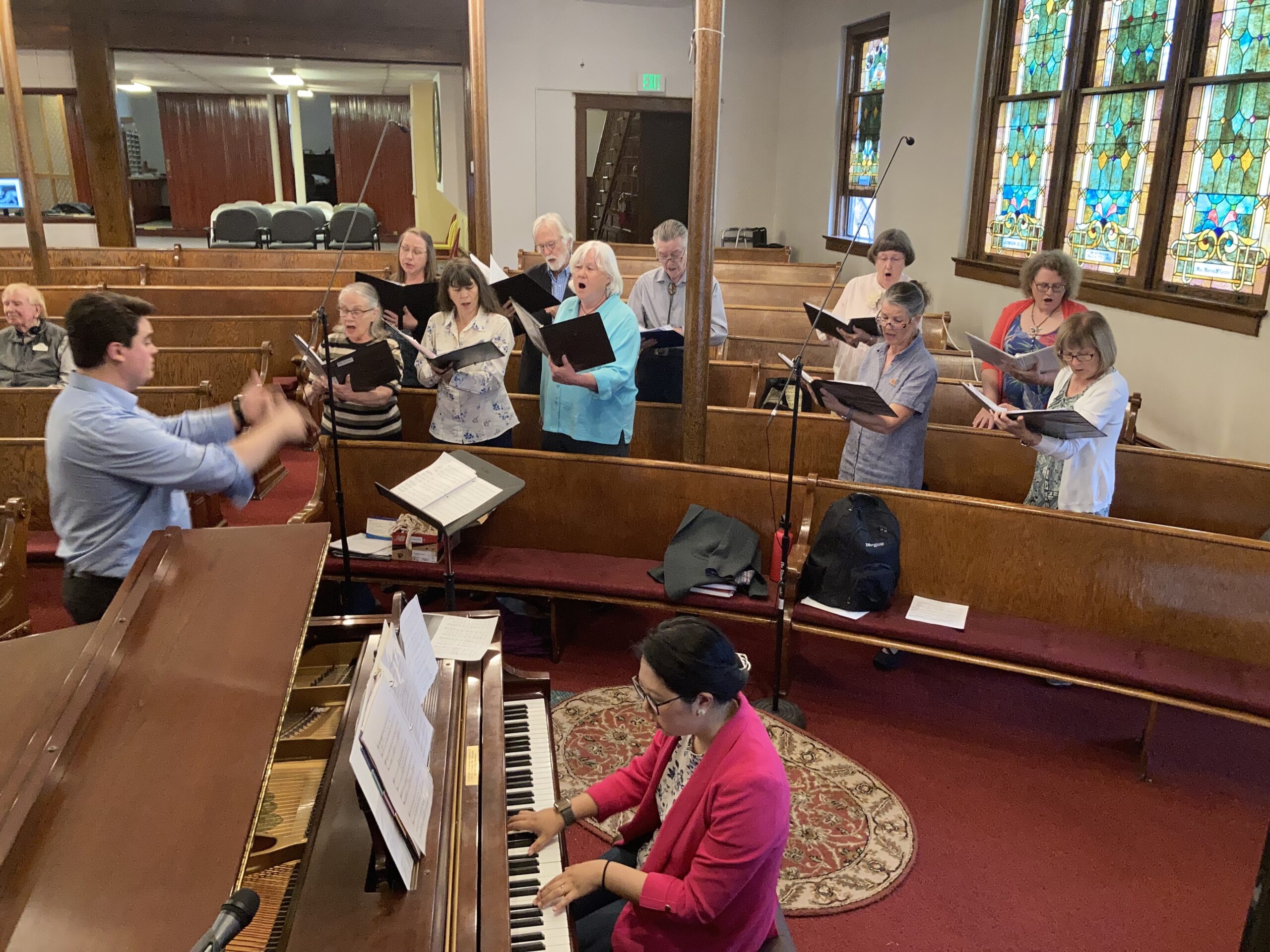 Choir and piano player performing in church