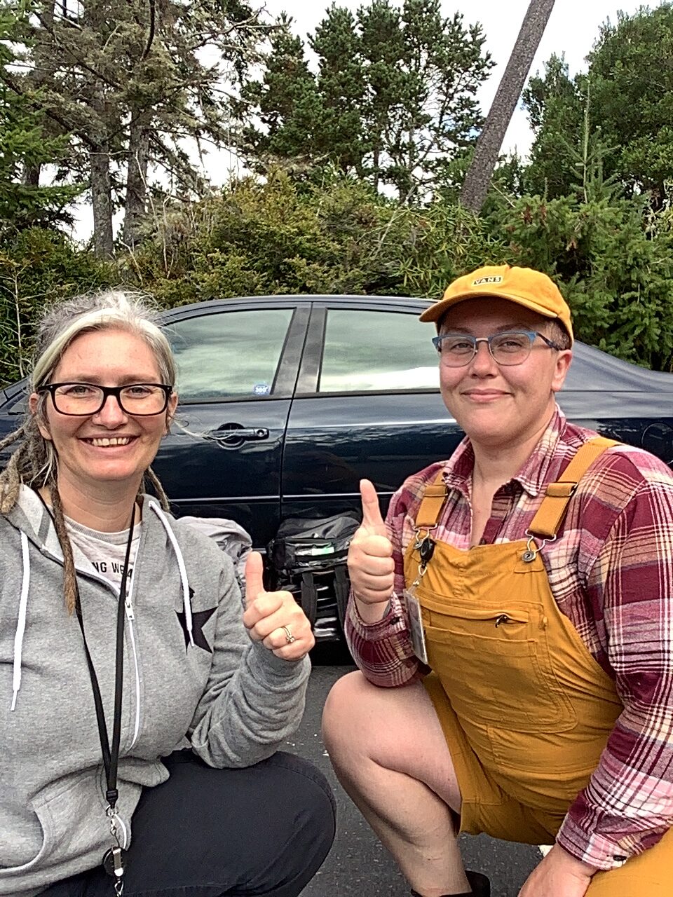 Photo of two smiling outreach workers