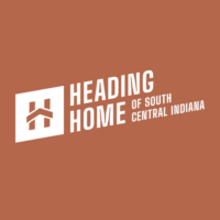 Image of the Heading Home of South Central Indiana logo. The logo is white on a brown background. The text in the logo reads "HEADING HOME CENTRAL INDIANA OF SOUTH". The logo is a symbol of the organization's mission to reduce homelessness in South Central Indiana.