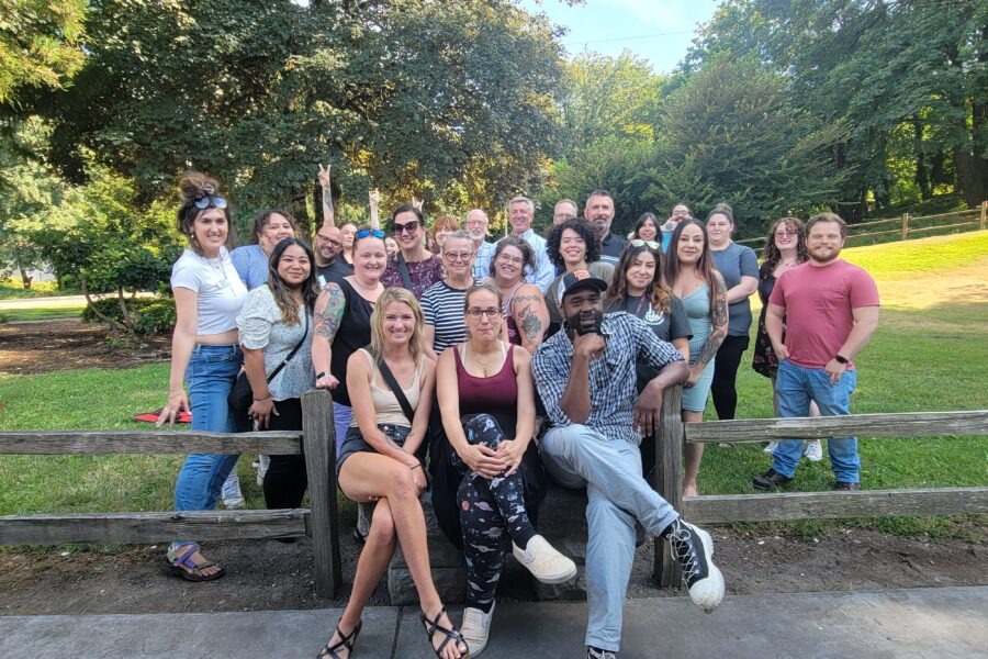 Group shot outside on a sunny day of Thurston County Built for Zero team