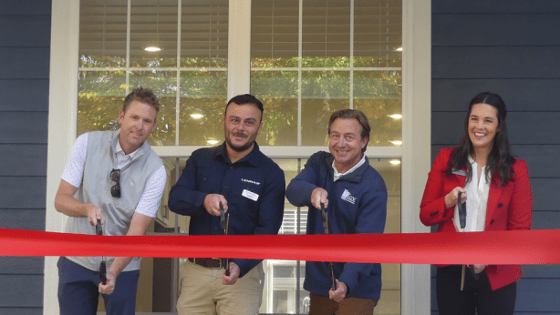 Cutting the ribbon at Veteran's Village